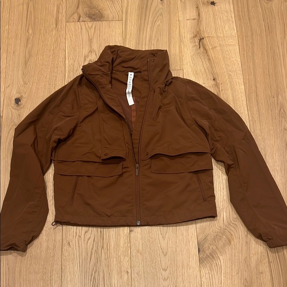 Lulu Lemon Brown Rain Jacket with Collapsible Hood High Collar and Relaxed Fit - Picture 1 of 5